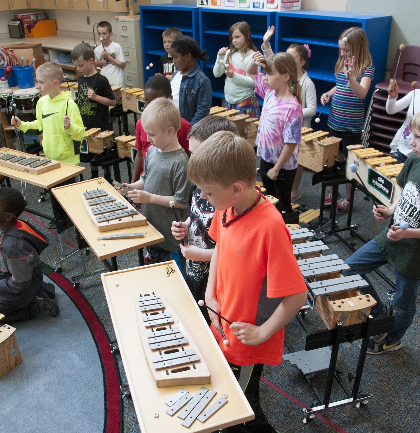 Students playing xylophones in an Orff music group class